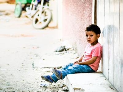 Lonely child sat on a street